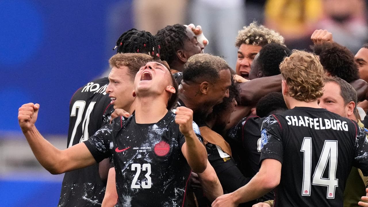 Canada score late to win first of World Cup knockouts