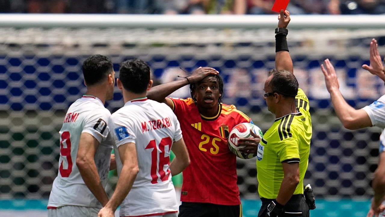 Iran battle to draw with 10-man Belgium, group tightens
