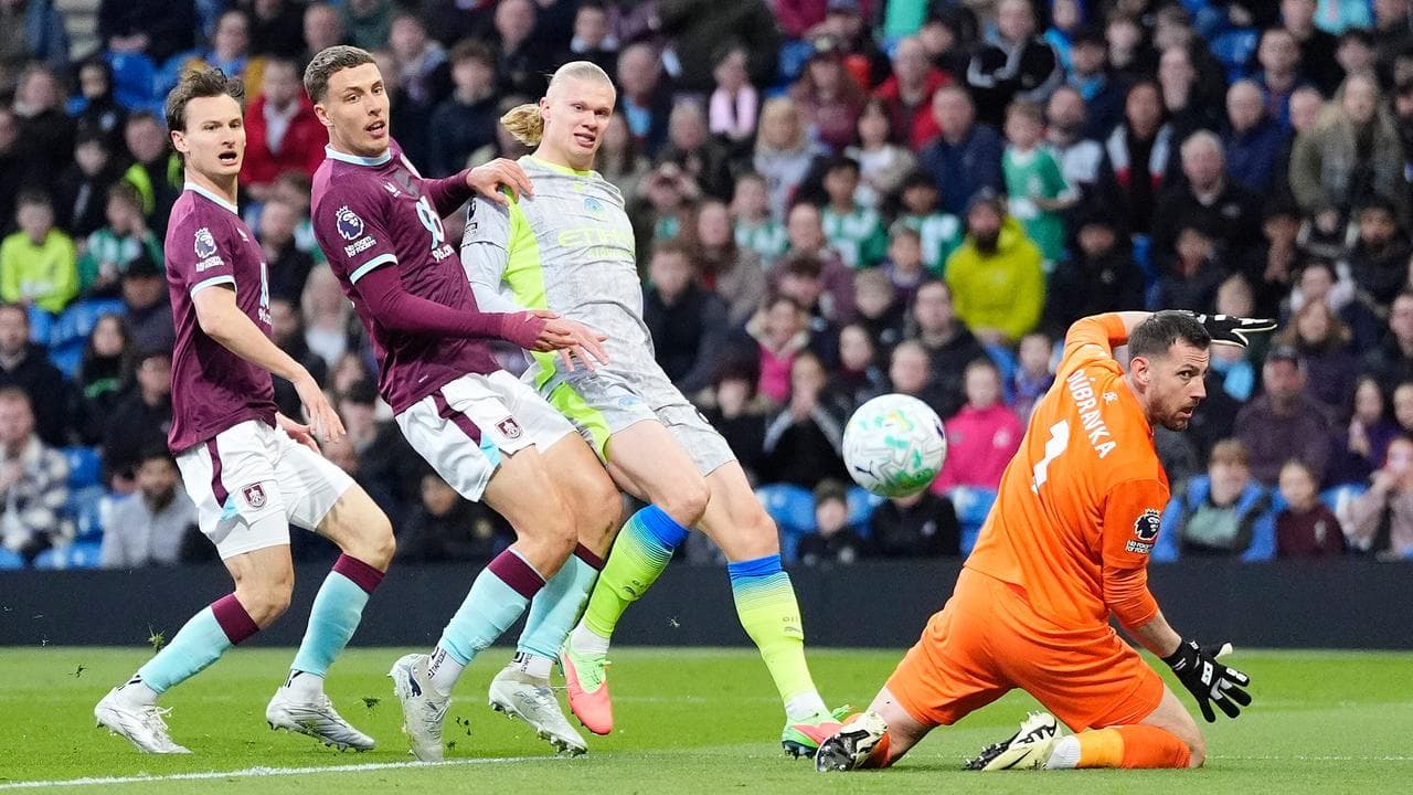 Man City reach Premier League summit, send Burnley down