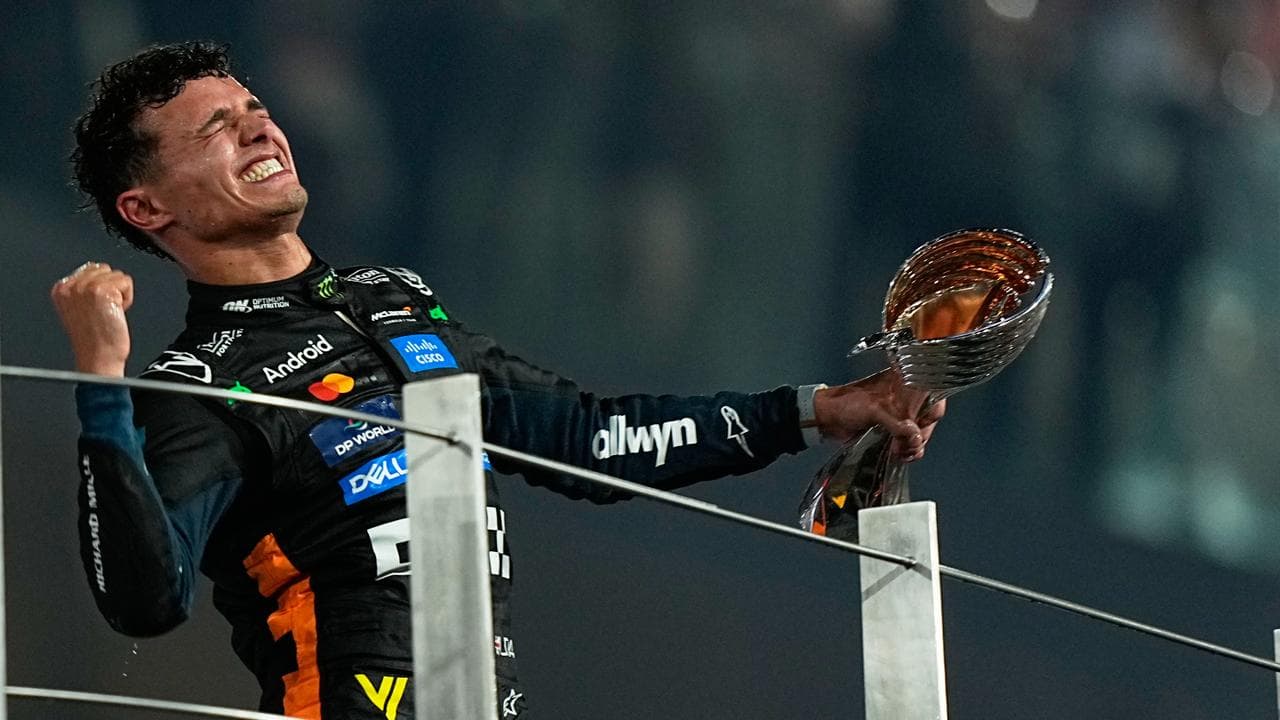 Lando Norris handed F1 trophy, Verstappen absent