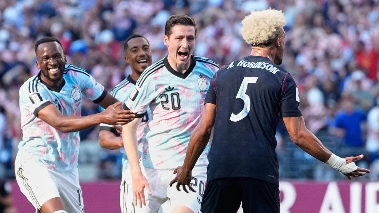 Belgium into QFs after beating last remaining co-hosts