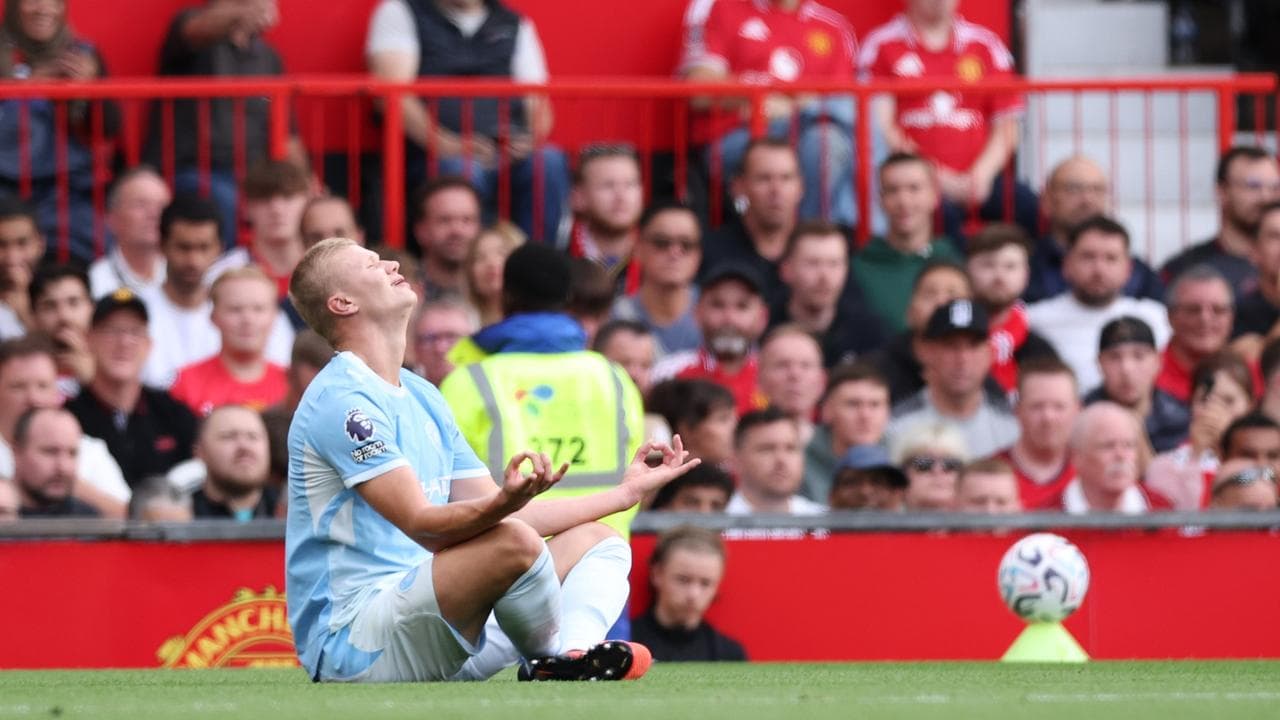 Disputed Haaland goal wins derby for 10-man Man City